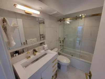 a bathroom with a sink and a toilet and a shower at Alexander 1102 in Miami Beach