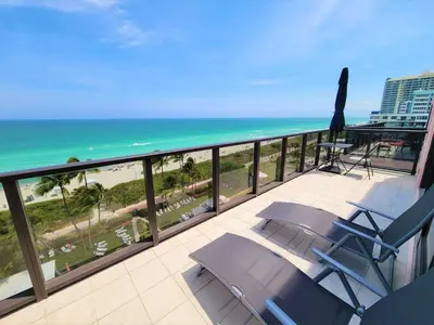 a balcony with a view of the beach and the ocean at Alexander 1102 in Miami Beach