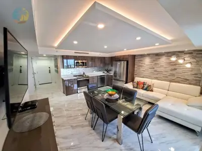a living room with a dining table and a couch at Alexander 1103 in Miami Beach