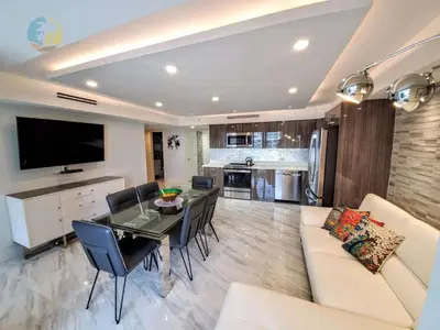 a kitchen and living room with a table and a couch at Alexander 1103 in Miami Beach