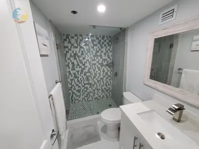 a bathroom with a shower and a toilet and a sink at Alexander 1104 in Miami Beach