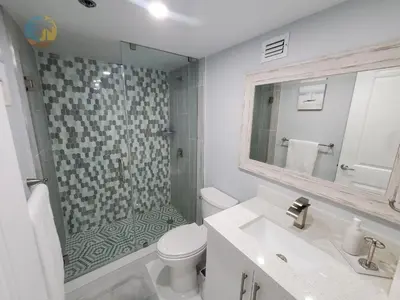 a bathroom with a shower and a toilet and a sink at Alexander 1104 in Miami Beach