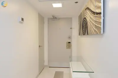 a room with a glass table and a painting on the wall at Alexander 1121 in Miami Beach