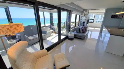 a living room with a view of the ocean at Alexander 1401 in Miami Beach