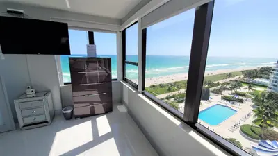 a room with a view of the beach and the ocean at Alexander 1401 in Miami Beach