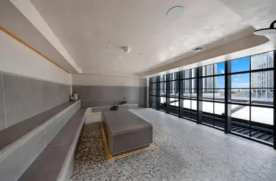 a large room with a couch and large windows at Stylish Downtown 1-BD Condo in Miami