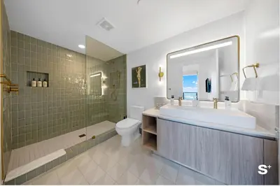 a bathroom with a tub and a sink and a toilet at Upscale 3-BD Condo in Downtown Miami in Miami