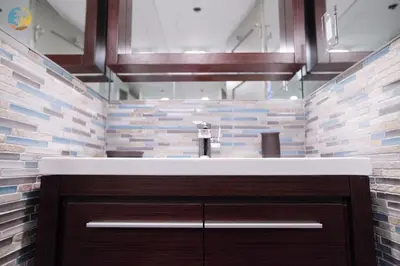 a bathroom with a sink and a brick wall at Alexander 1419 in Miami Beach