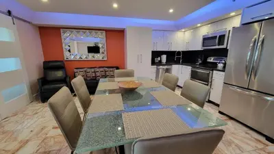 a kitchen and dining room with a table and appliances at Alexander 1420 in Miami Beach