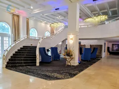 a staircase in a building with blue chairs at Alexander 1421 in Miami Beach