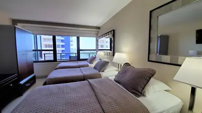 a bedroom with two beds and a large window at Alexander 1421 in Miami Beach