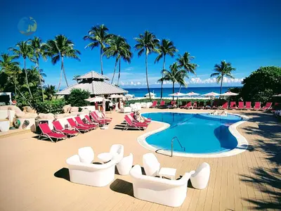 a resort with a pool and chairs and the ocean at Alexander 1618 in Miami Beach