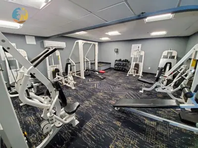 a gym with several treadmills and tread machines at Alexander 1618 in Miami Beach