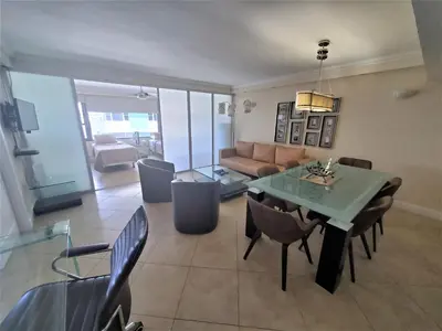 a living room with a table and a couch at Alexander 1620 in Miami Beach