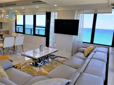 a living room with a couch and a table at Alexander 1701 in Miami Beach