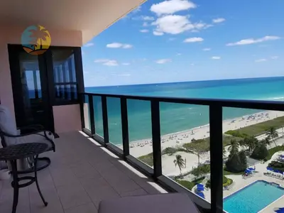 a balcony with a view of the beach and ocean at Alexander 1701 in Miami Beach