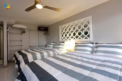 a bedroom with two beds and a ceiling fan at Alexander 519 in Miami Beach