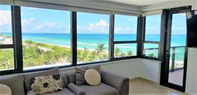 a living room with a couch and views of the ocean at Alexander 802 in Miami Beach