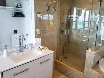 a bathroom with a sink and a shower at Alexander 802 in Miami Beach