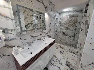 a bathroom with a sink and a mirror at Alexander 807 in Miami Beach