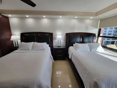two beds sitting next to each other in a bedroom at Alexander 819 in Miami Beach