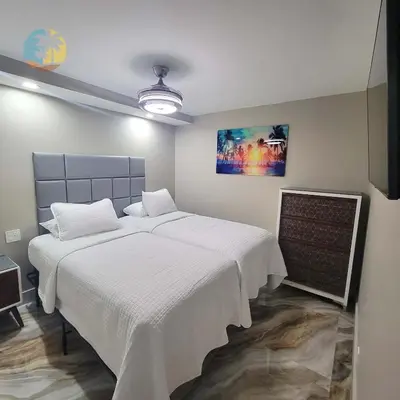 a bedroom with two beds with white sheets at Alexander 821 in Miami Beach