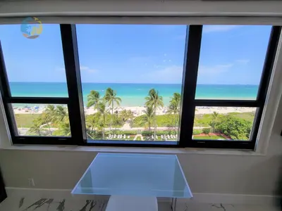 a window view of the beach from a condo at Alexander 901 in Miami Beach