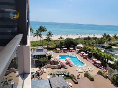 a view of a resort with a pool and the beach at Alexander in Miami Beach