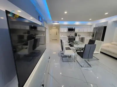 a kitchen and dining room with a table and chairs at Alexander in Miami Beach