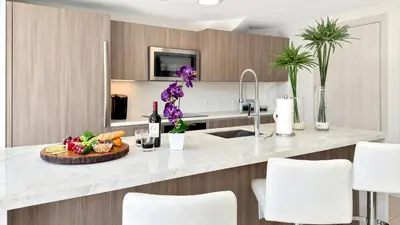 a kitchen with a counter with a tray of food at Tiffany Tides - Resort-Style Beach Townhome - Gym, Rooftop Pool and Sauna in Fort Lauderdale
