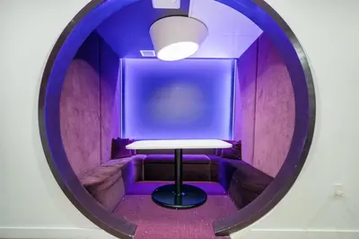 a round mirror with a table in a purple room at Rare Corner Unit Private Terrace & Sunset Views in Miami