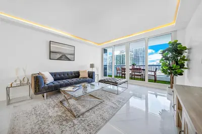 a living room with a couch and a table at The Grand Wonder Biscayne in Miami