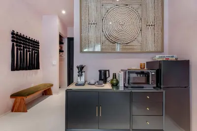 a kitchen with a refrigerator and a microwave at Artisan Studio- Breakfast Nook by Design District in Miami