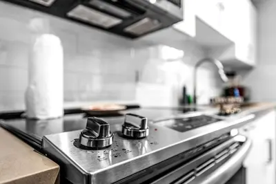 a kitchen with a stove top with a sink at Stylish 1BR Unit With Free Parking Near Wynwood in Miami