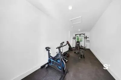 a gym with two exercise bikes in a room at Stylish Studio - Parking & Gym Near Aventura in Miami