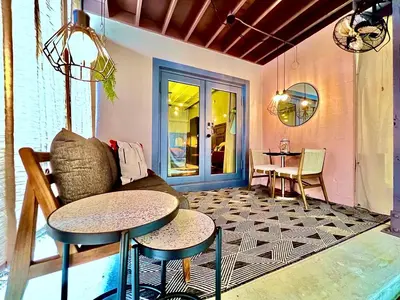 a living room with a couch and a table at Double Rainbow Suites 24th in Fort Lauderdale