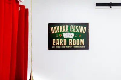 a sign for a card room on a door at Havana Casino in Miami