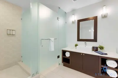 a bathroom with a sink and a glass shower at Stylish Apartment 1BR - 2BTH in Miami