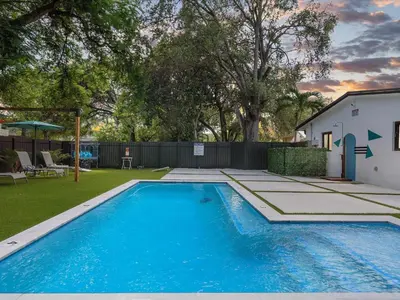 a swimming pool in the backyard of a house at Hidden Gem Studio Near Wynwood & Beaches in Miami