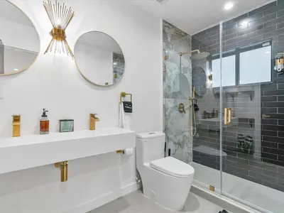 a bathroom with a toilet and a sink and a shower at Hidden Gem Studio Near Wynwood & Beaches in Miami