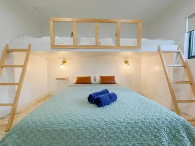 a bed in a room with two bunk beds at Designer 1BR Retreat Heart of Miami Pool in Miami