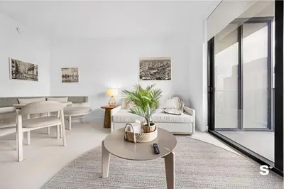 a living room with a couch and a table at Skyline 1-BD Condo - City & Ocean View in Miami