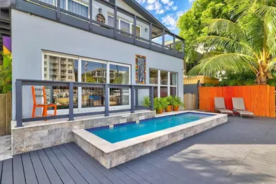a house with a swimming pool in the backyard at Orange Dream on the Water in Fort Lauderdale