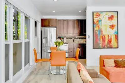 a living room with a table and a couch at Orange Dream on the Water in Fort Lauderdale