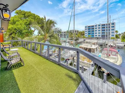 a balcony with a view of a marina with boats at Orange Dream in the Sky in Fort Lauderdale