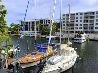 two boats docked in a marina with buildings in the background at Orange Dream in the Sky in Fort Lauderdale