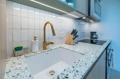 a kitchen with a sink and a counter top at Splendid 1 Bed - Amazing views in Miami