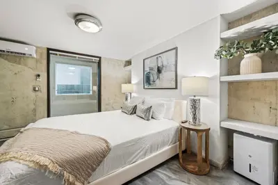 a white bedroom with a bed and a window at Luxury Miami Villa with Large Pool & BBQ, Perfect Getaway! in Miami