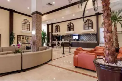 a lobby of a hotel with couches and a bar at Departamento sobre la Playa con vista a la Collins Ave in Sunny Isles Beach