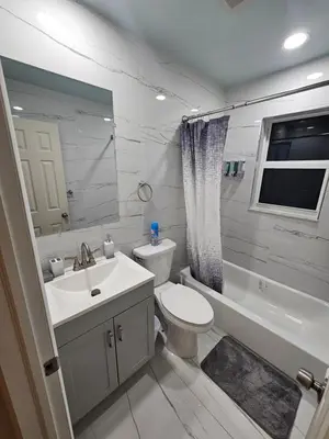 a bathroom with a sink and a toilet and a bath tub at Hollywood Happiness in Hollywood
